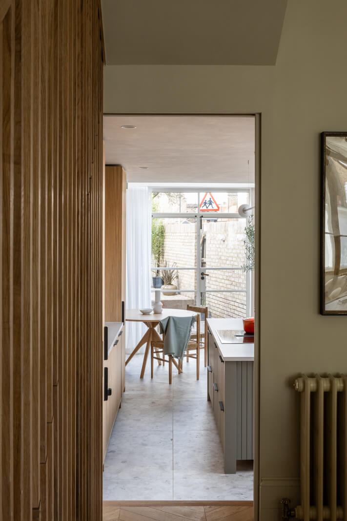 A Renovated Victorian House with Oak Features 8 kitchen with island and round table