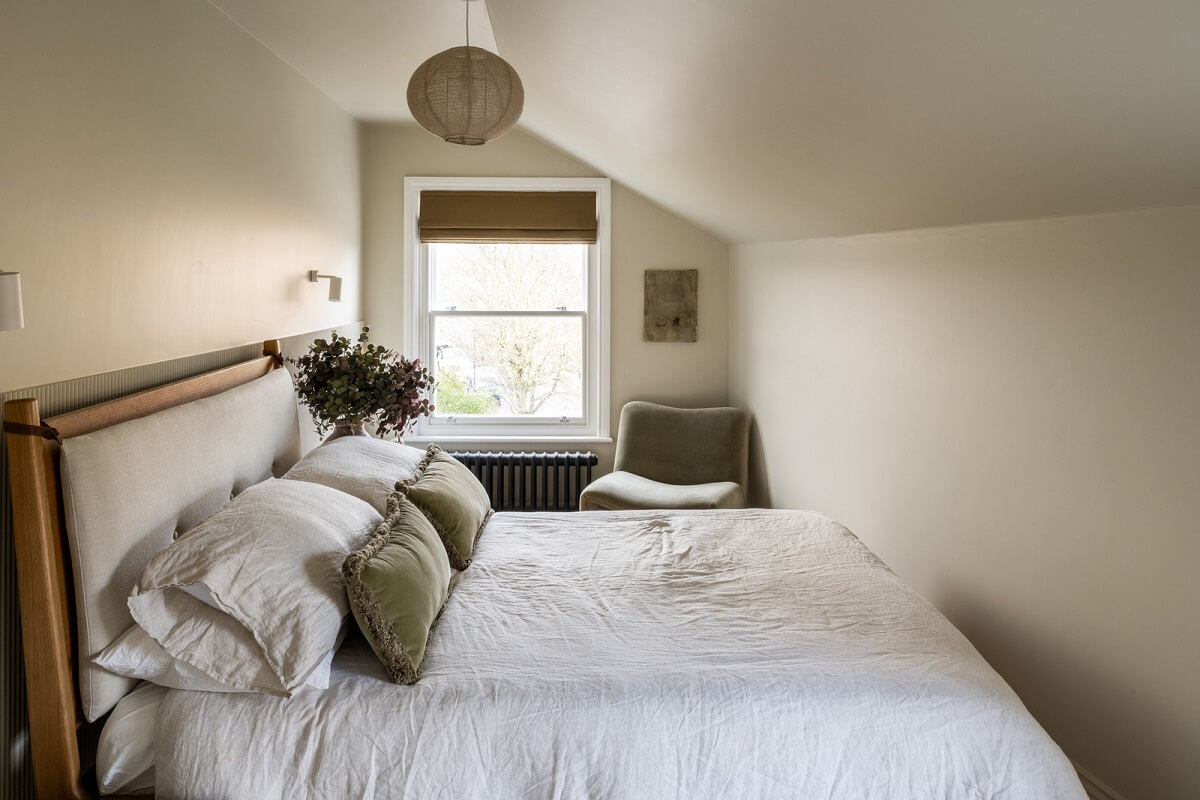 A Renovated Victorian House with Oak Features 21 light bedroom slanted ceiling