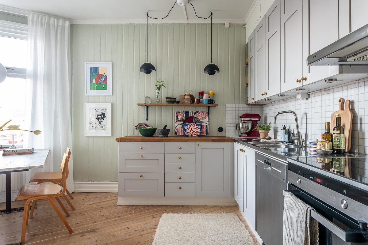Primary Color Accents in a Light Swedish Apartment 16 light-gray-kitchen-cabinets-light-green-walls-nordroom