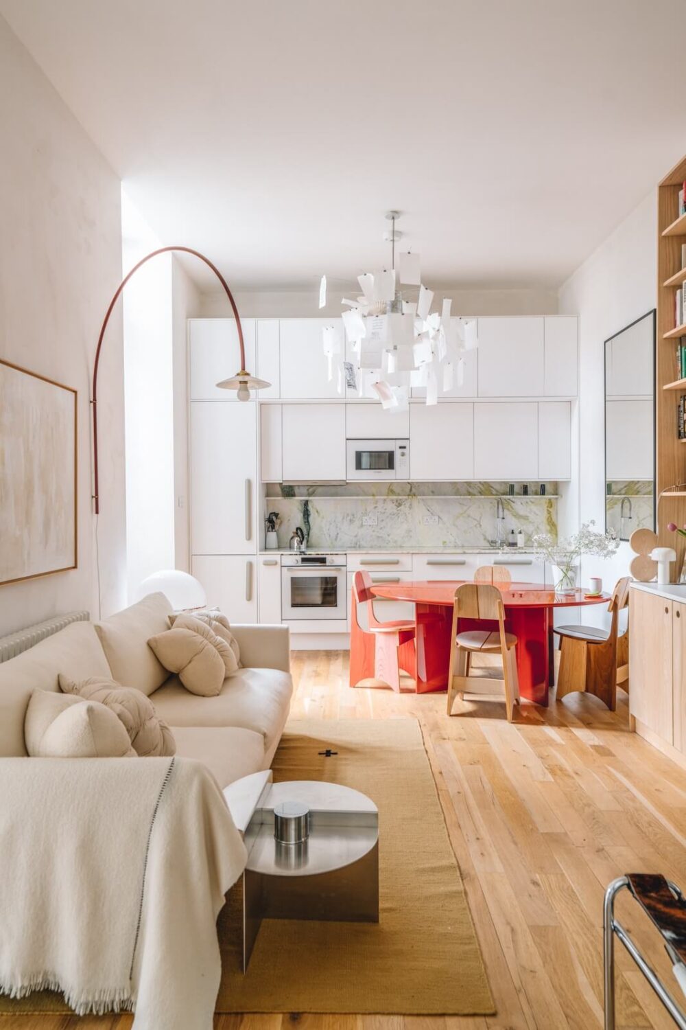 50+ Rooms That Prove ‘The Unexpected Red Theory’ Really Works 29 light open plan living space with kitchen and red dining table