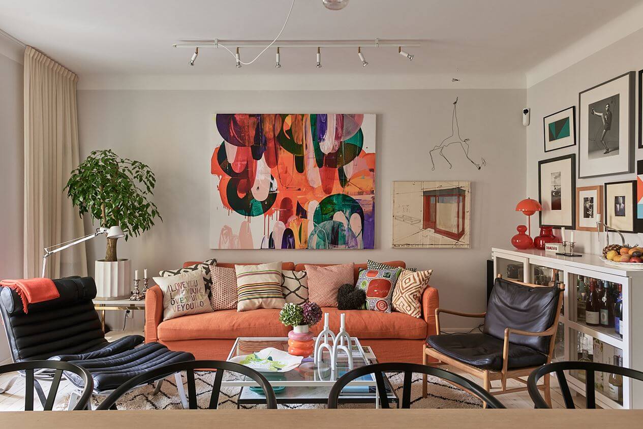 An Art-Filled Scandinavian Apartment 3 living-room-art-orange-pink-sofa-nordroom