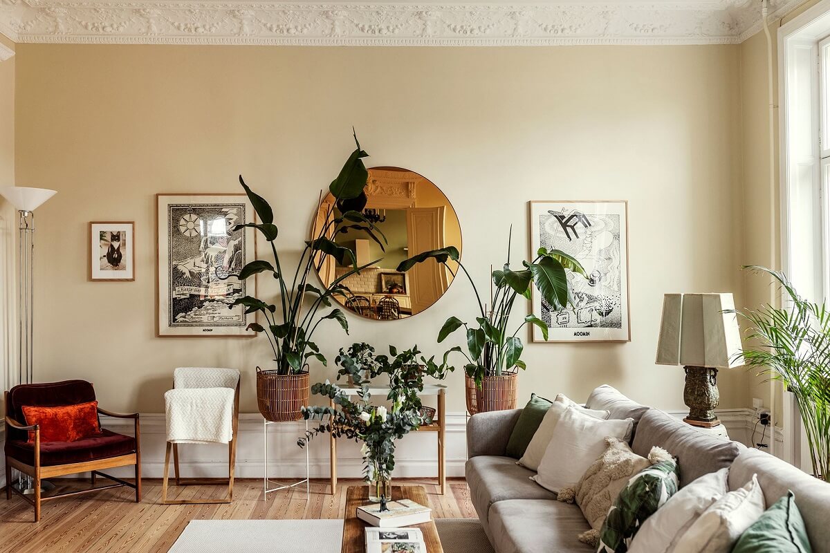 Stunning Fireplaces in a Historic Stockholm Apartment 4 living-room-beige-walls-round-mirror-nordroom