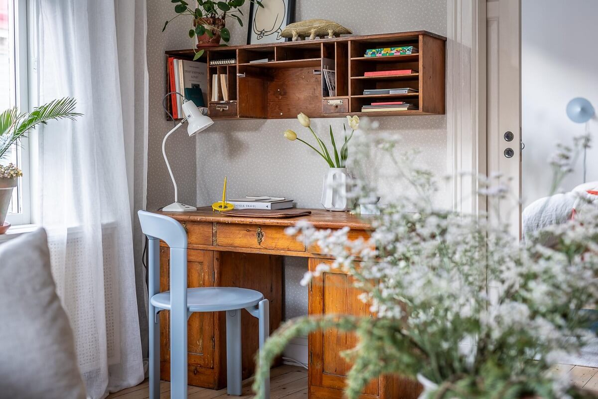 Primary Color Accents in a Light Swedish Apartment 6 living-room-desk-pastel-blue-chair-nordroom