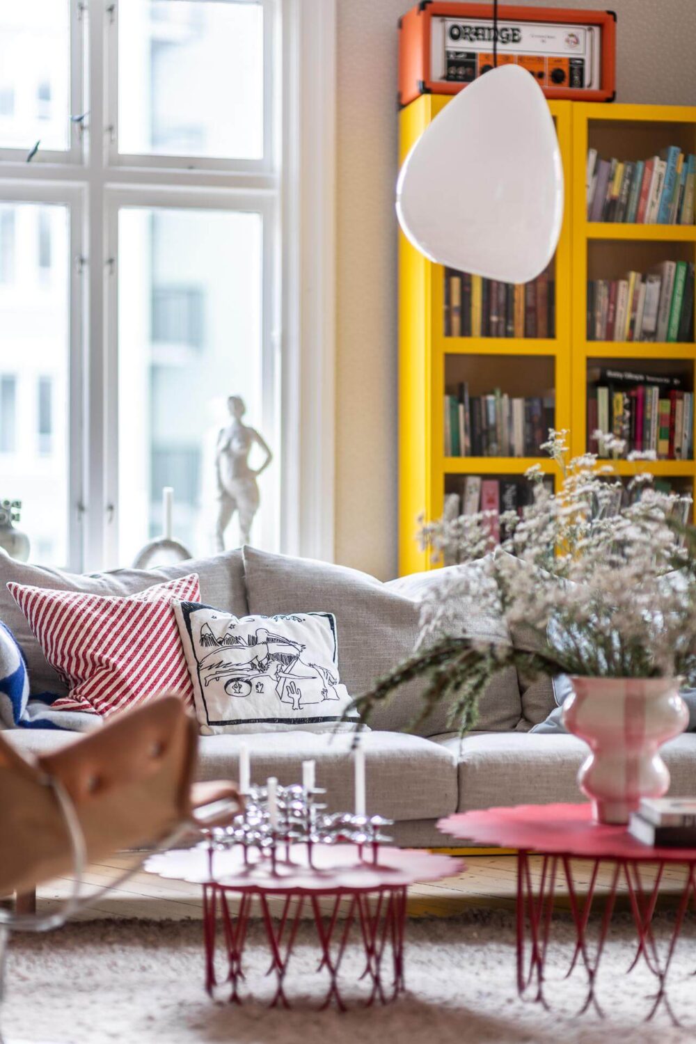 Primary Color Accents in a Light Swedish Apartment 4 living-room-detail-yellow-cabinet-nordroom