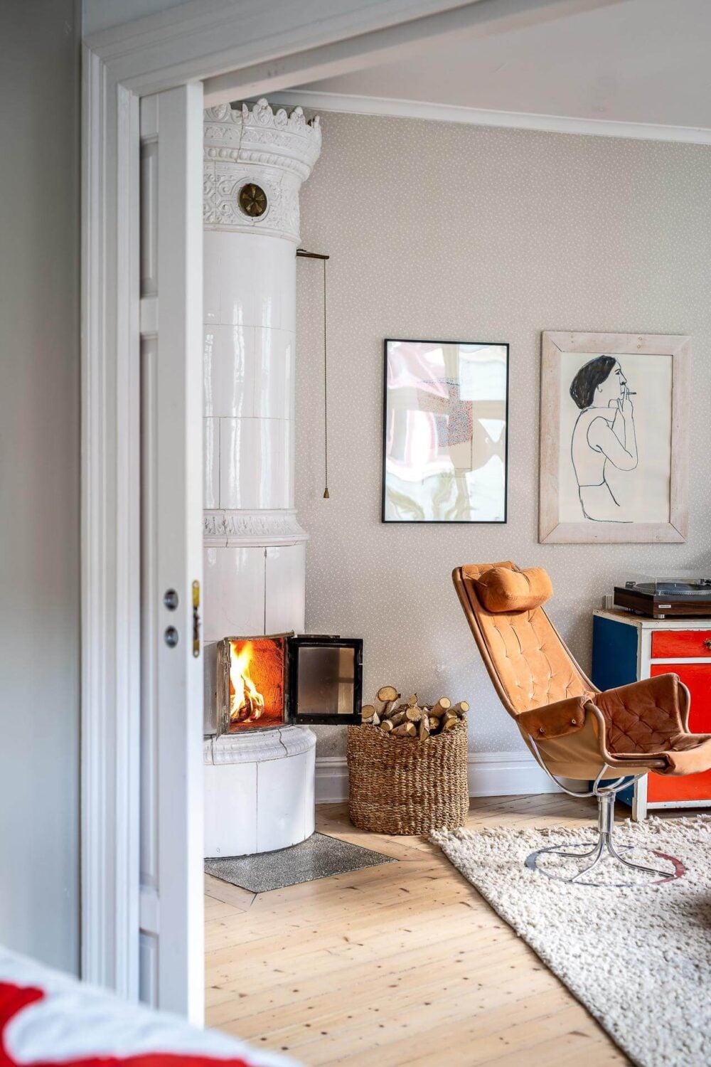 Primary Color Accents in a Light Swedish Apartment 3 living-room-fireplace-nordroom