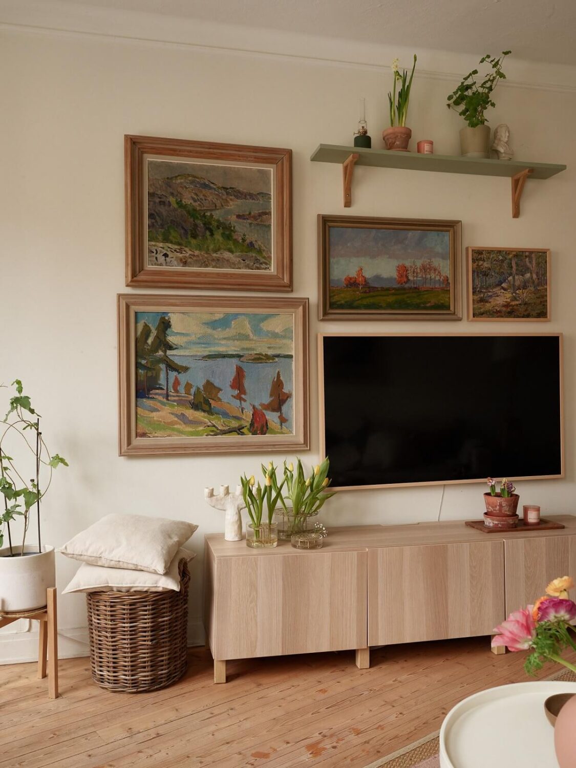 A Charming Swedish Apartment with a Cottage-Style Kitchen 5 living room gallery wall nordroom
