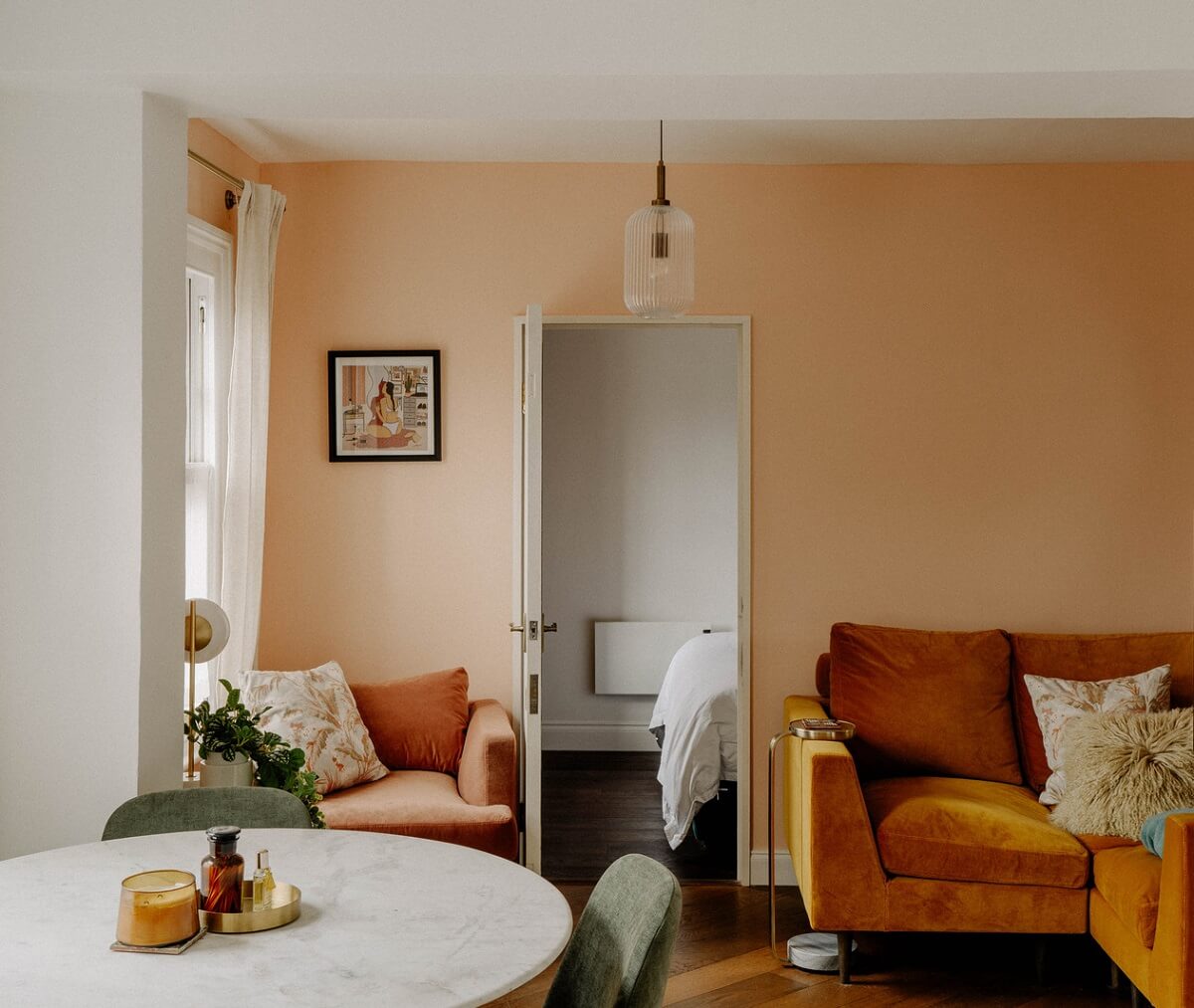 A Tiny London Apartment with Refined Materials and Colors 2 living room pink walls