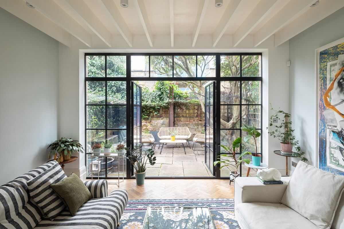 A Victorian House in London with Three Outdoor Spaces 11 living room striped sofa