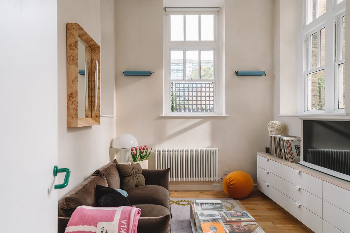 High Ceilings and Modern Design in a Light London Apartment 10 living room television brown sofa