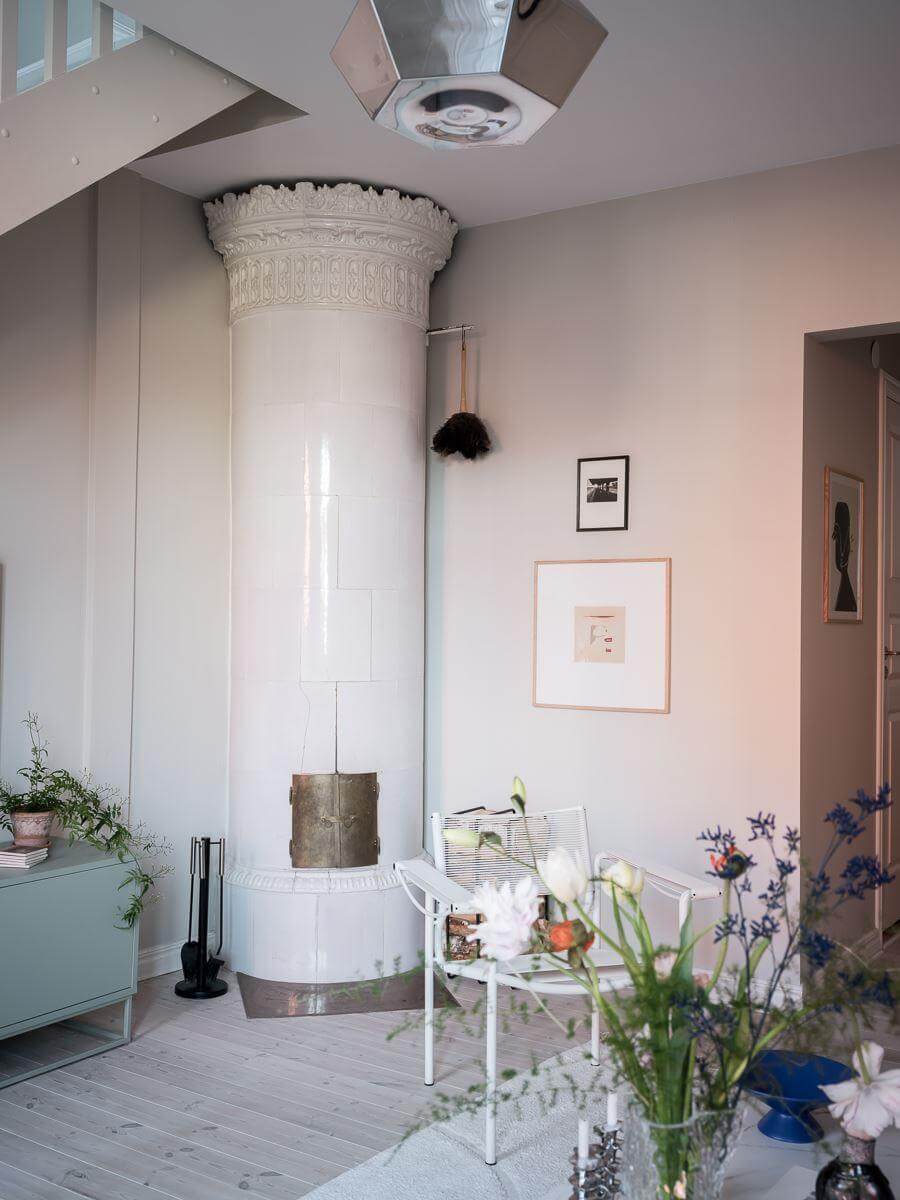A Light-Filled Swedish Duplex is a Lovely Family Home 6 living room with round fireplace