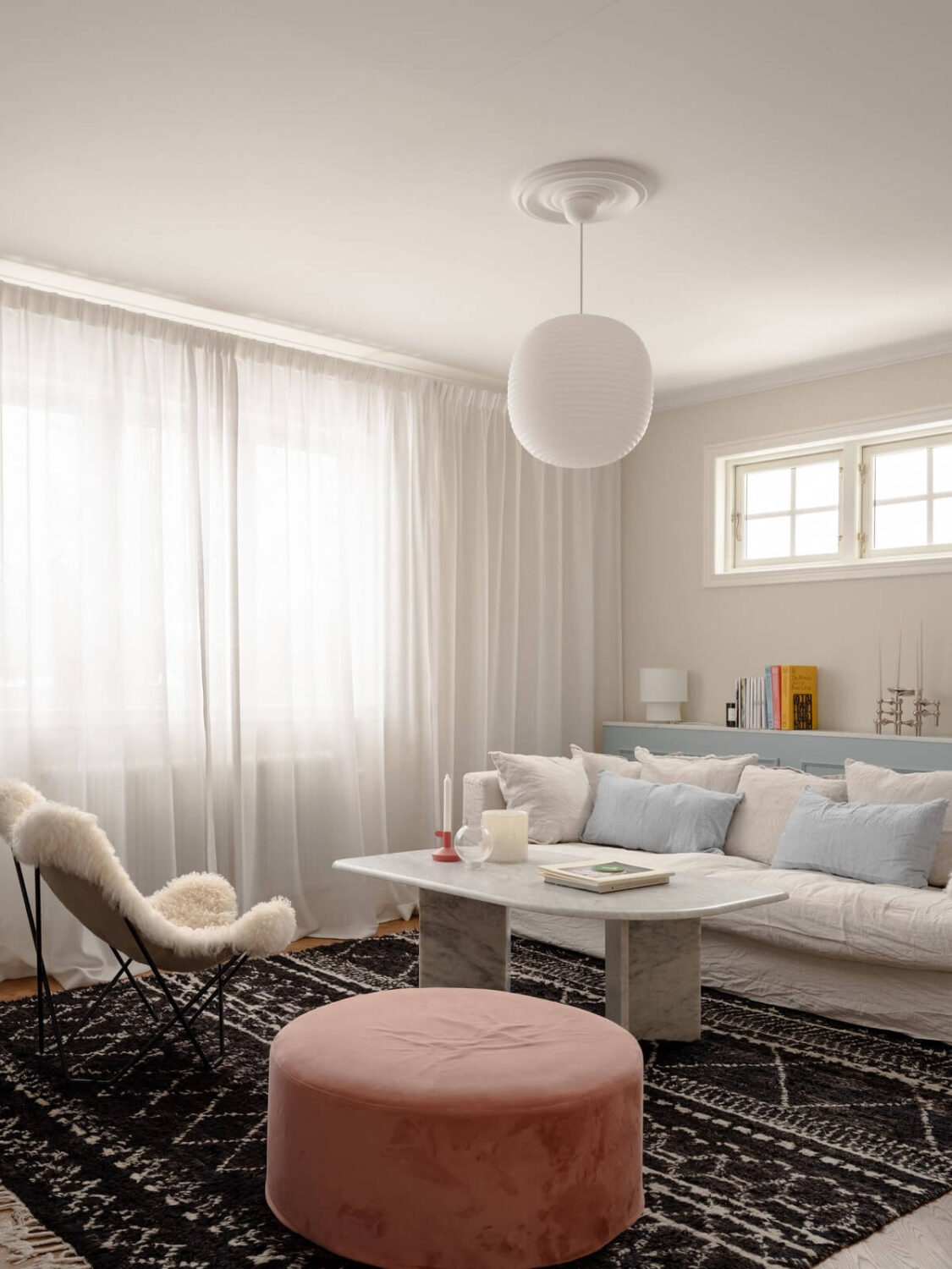 A Light Family Home in a Historic Yellow Villa 7 living room with rug and pink ottoman
