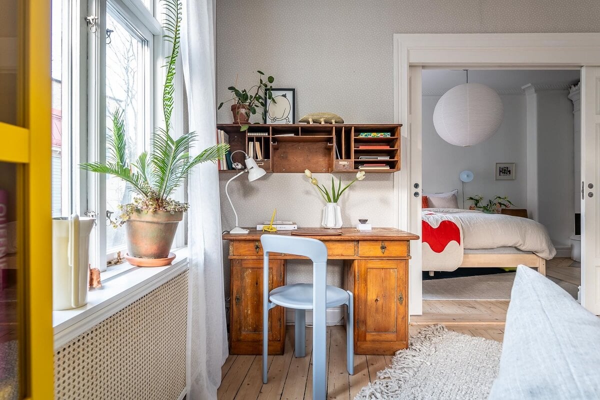 Primary Color Accents in a Light Swedish Apartment 7 living-room-wooden-desk-nordroom
