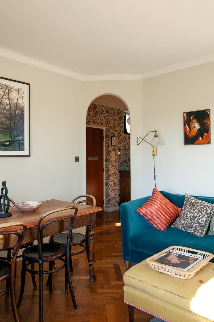 A Charming Apartment in an Art Deco Building in London 3 living-room-wooden-floor-blue-sofa-arch-doorway-nordroom