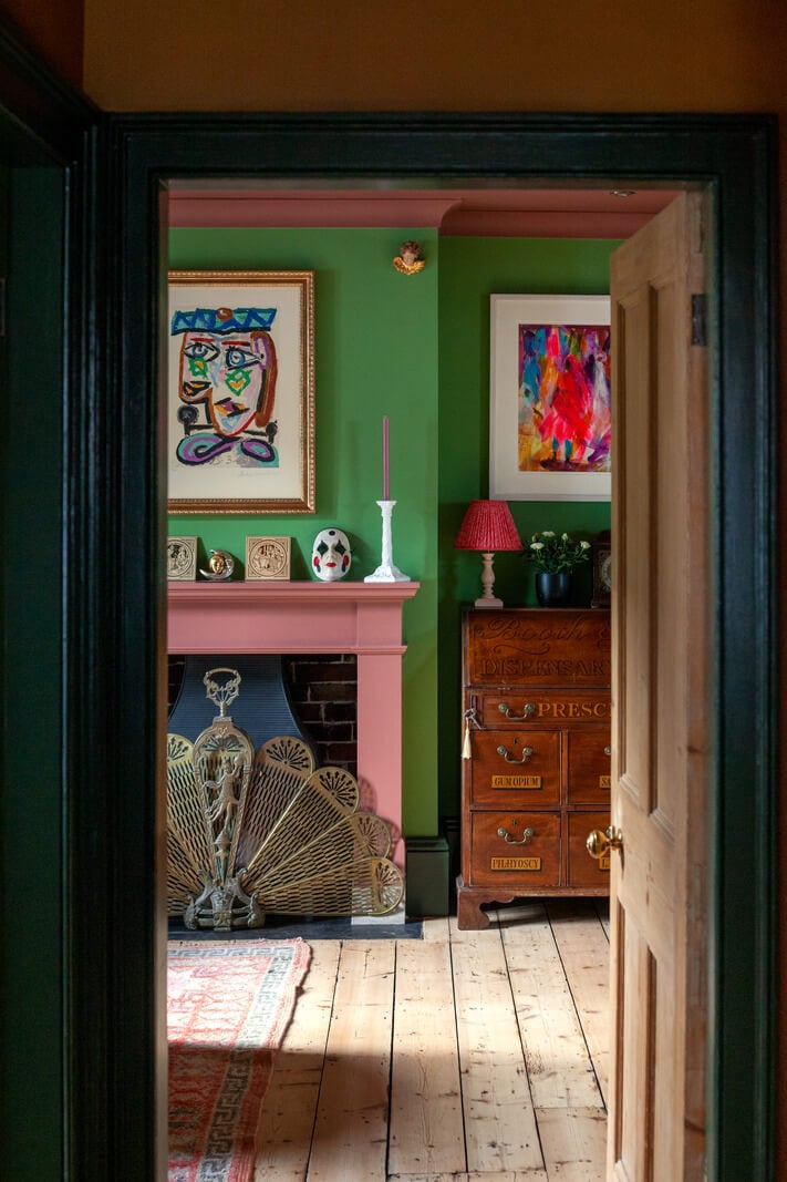Bold Colors in a Charming Historic House in England 10 living-room-wooden-floorboards-pink-fireplace-green-walls-nordroom