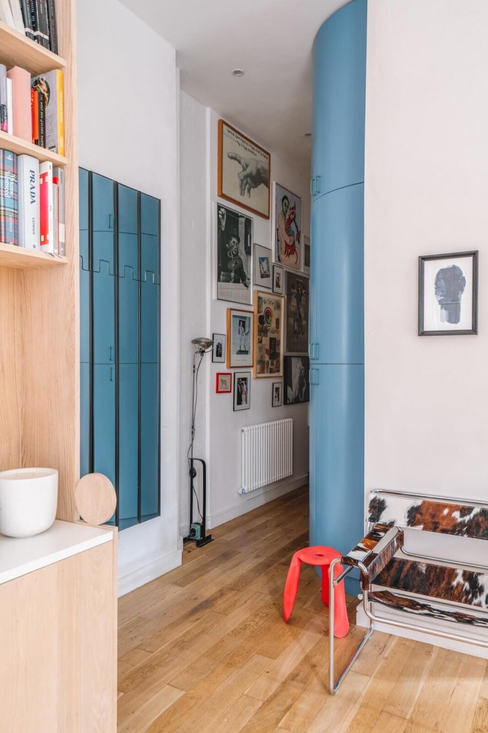 High Ceilings and Modern Design in a Light London Apartment 5 narrow hallway rounded blue cabinet nordroom