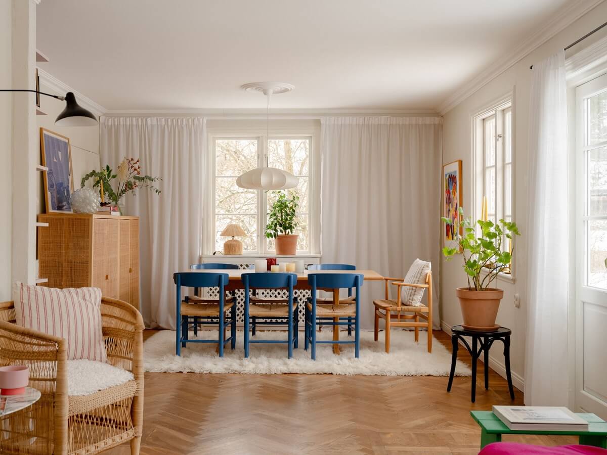 A Light Family Home in a Historic Yellow Villa 5 open plan living dining room blue dining chairs nordroom