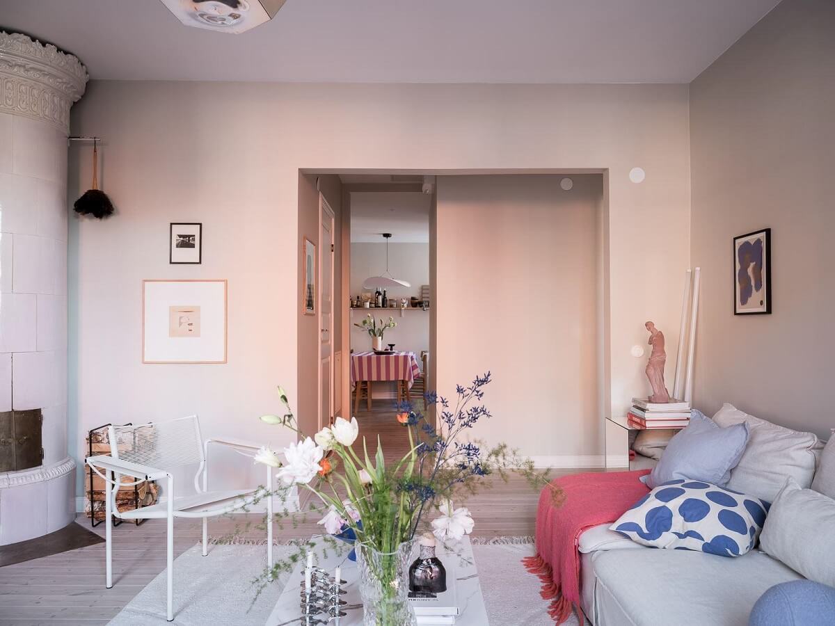 A Light-Filled Swedish Duplex is a Lovely Family Home 8 open plan scandinavian living room round fireplace nordroom