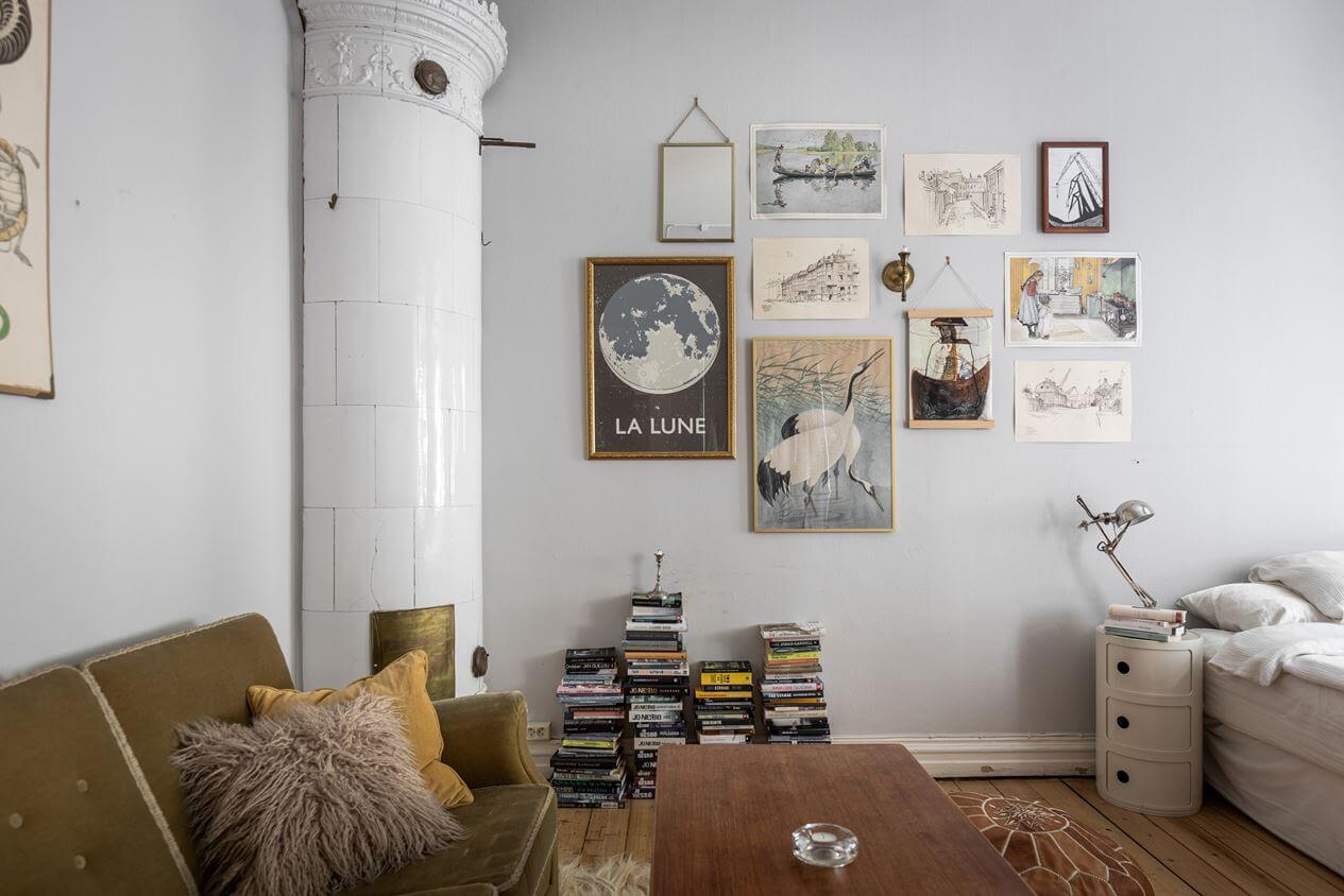 A Studio Apartment with Vintage Decor 3 round-fireplace-gallery-wall-studio-apartment-nordroom