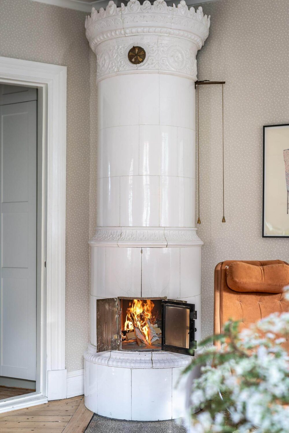 Primary Color Accents in a Light Swedish Apartment 8 round-swedish-fireplace-light-scandinavian-apartment-nordroom