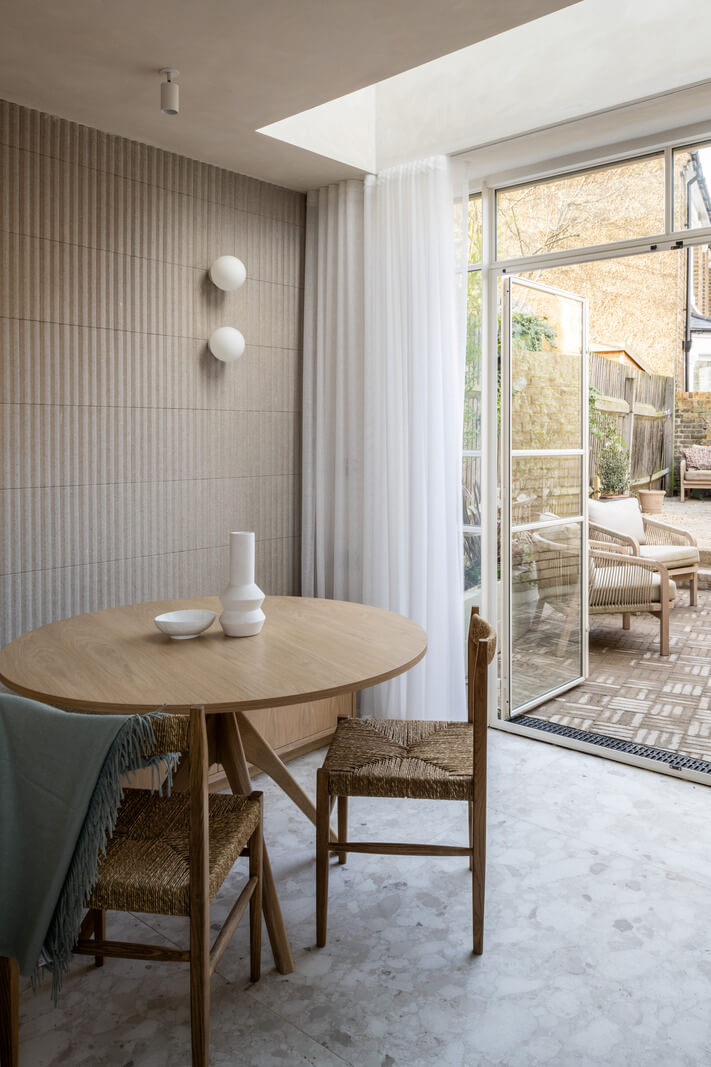 A Renovated Victorian House with Oak Features 11 round wooden dnng table skylight kitchen nordroom