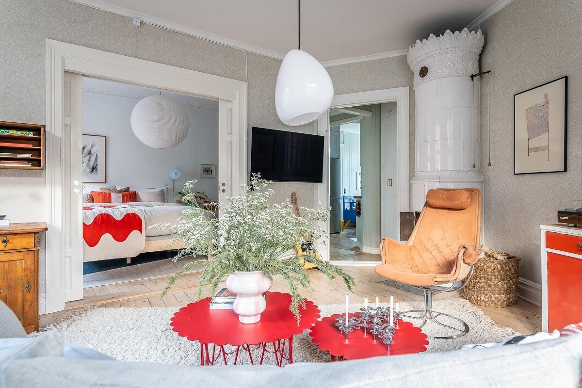 Primary Color Accents in a Light Swedish Apartment 9 scandi-living-room-fireplace-nordroom