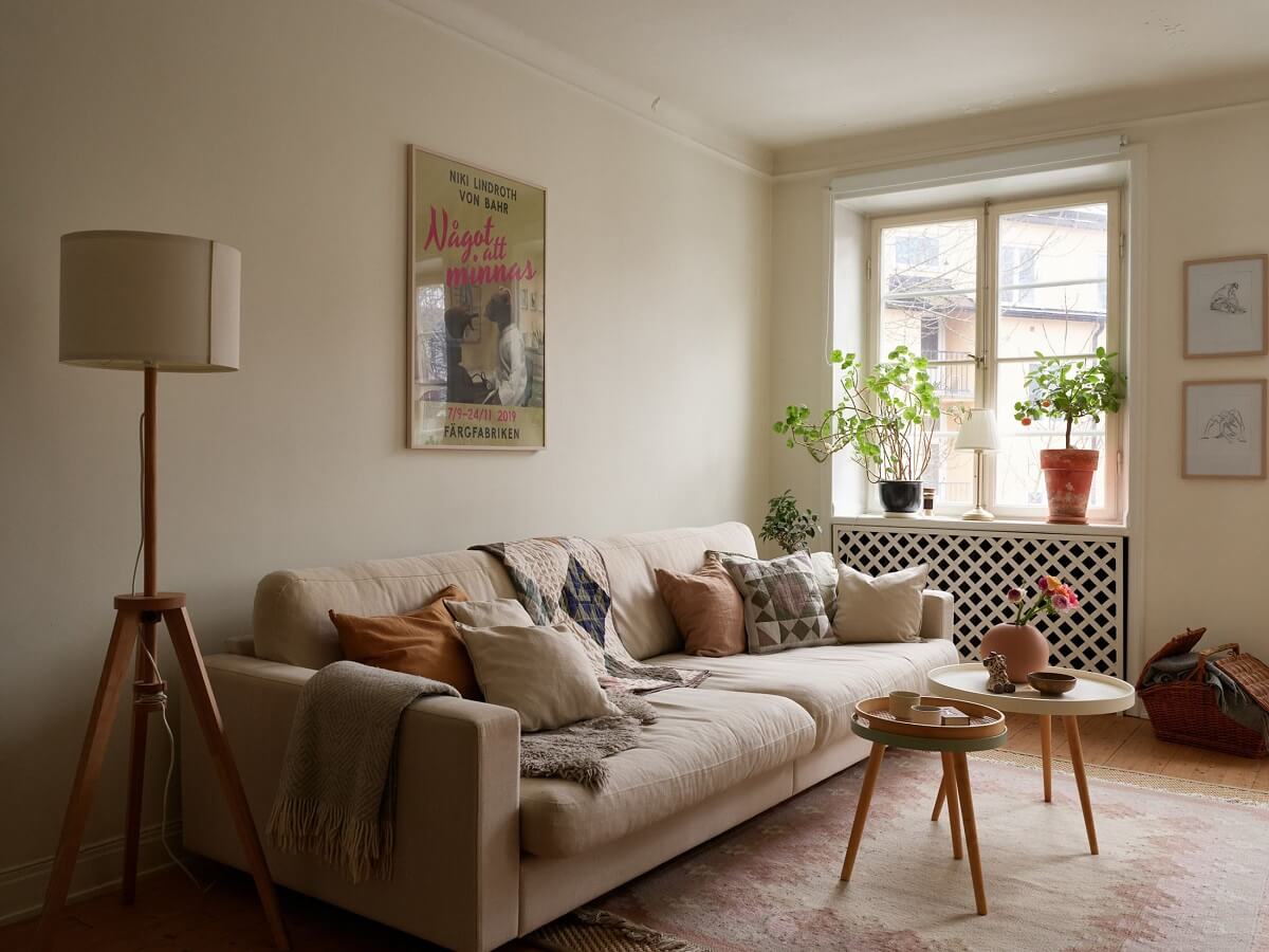 A Charming Swedish Apartment with a Cottage-Style Kitchen 3 scandinavian living room sofa with cushions nordroom