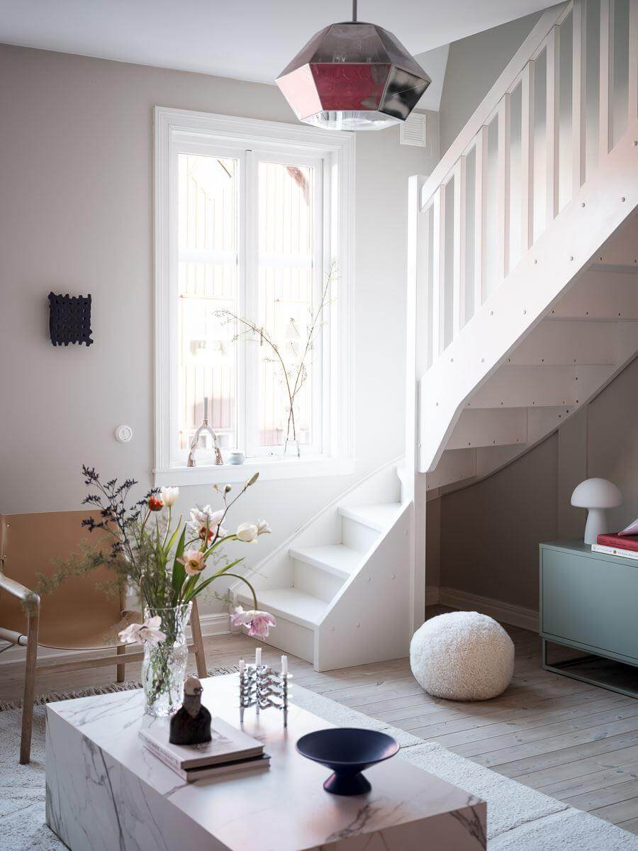 A Light-Filled Swedish Duplex is a Lovely Family Home 5 scandinavian living room with staircase nordroom