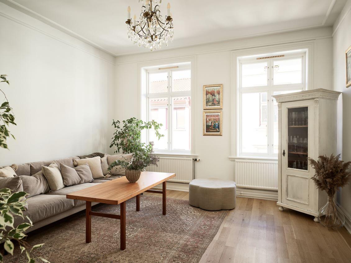 William Morris Wallpaper in a Scandinavian Apartment 3 scandinavian living room with white walls and gray sofa