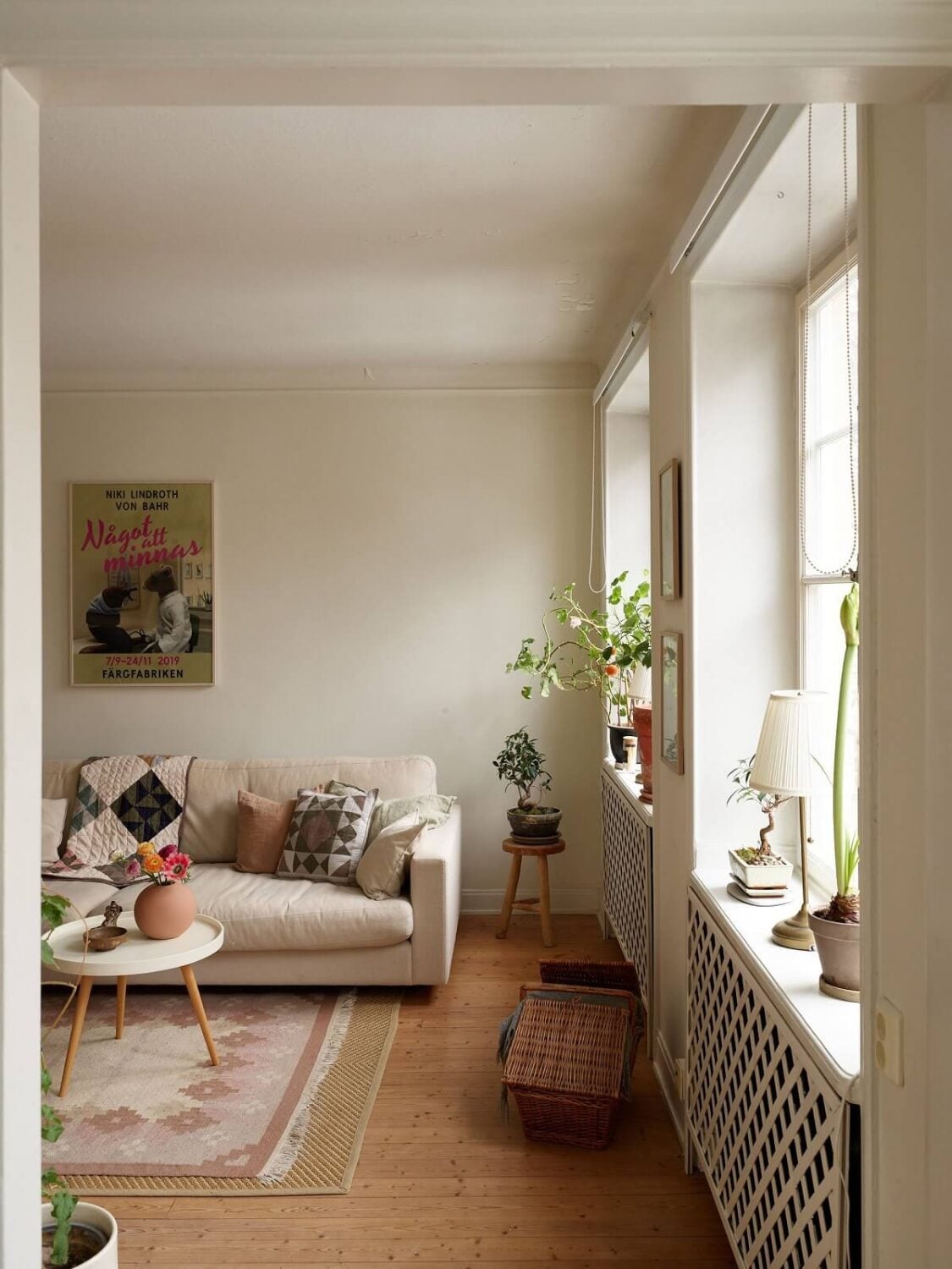 A Charming Swedish Apartment with a Cottage-Style Kitchen 2 scandinavian living room wooden floor