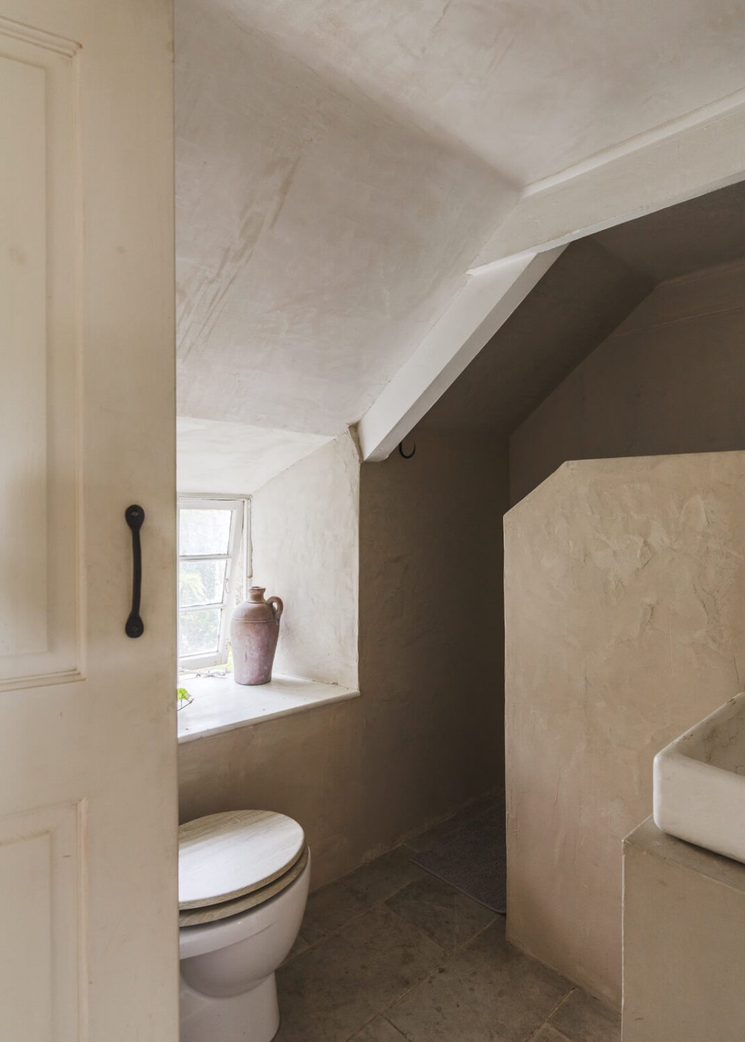 A Serene English Cottage in Cornwall 20 serene-bathroom-slanted-ceiling-shower-nordroom