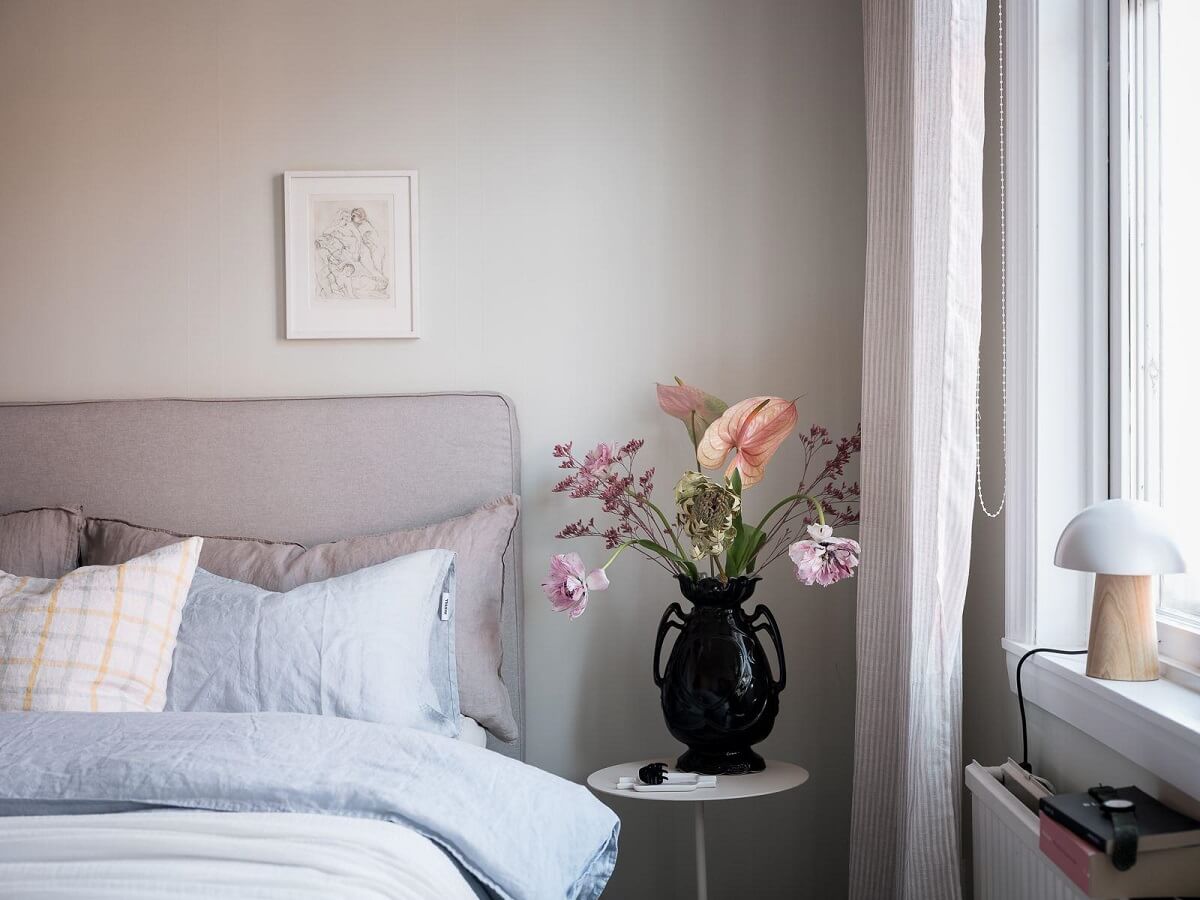 A Light-Filled Swedish Duplex is a Lovely Family Home 16 serene bedroom detail black vase nordroom