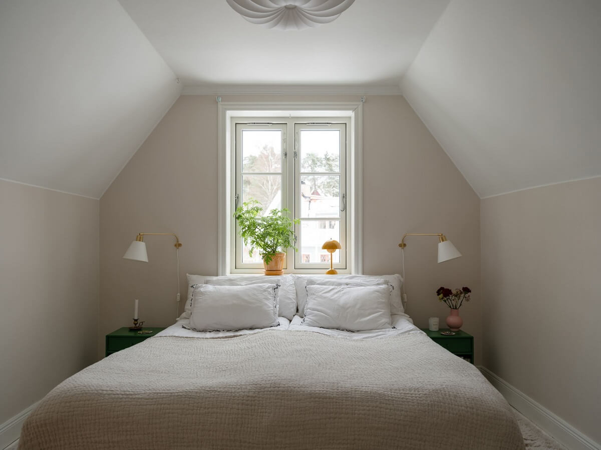 A Light Family Home in a Historic Yellow Villa 27 serene master bedroom slanted ceilings nordroom