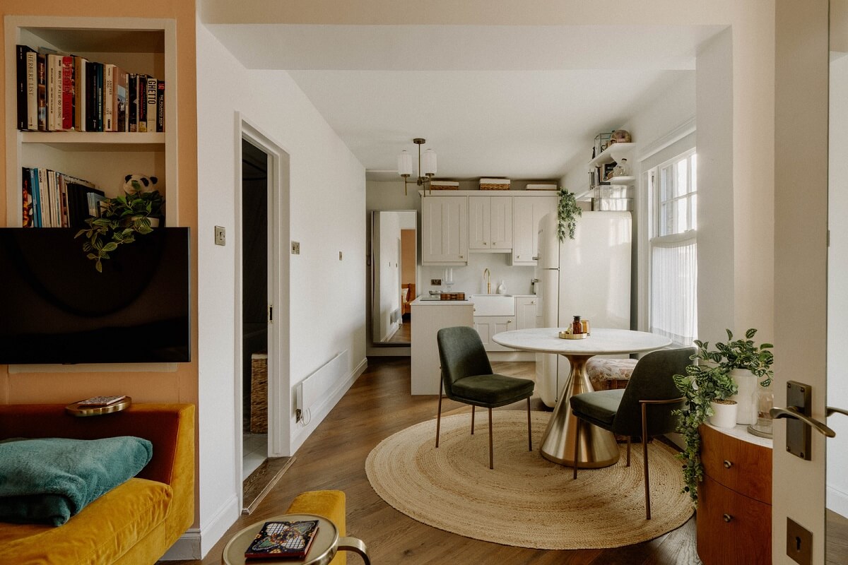 small open plan living room kitchen round dining table