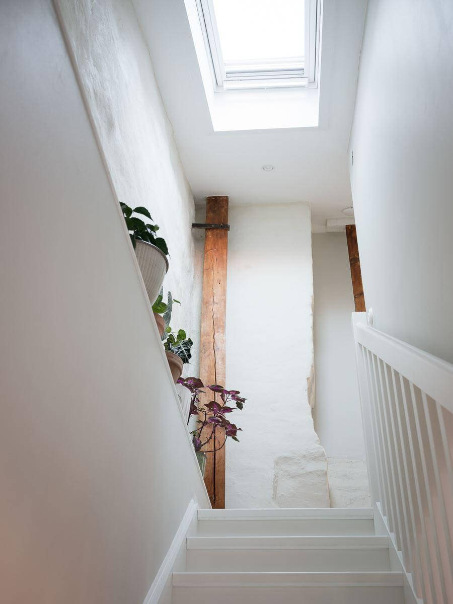 A Light-Filled Swedish Duplex is a Lovely Family Home 22 staircase skylight exposed beam