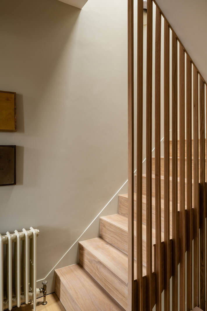 A Renovated Victorian House with Oak Features 7 staircase with wooden slats wall