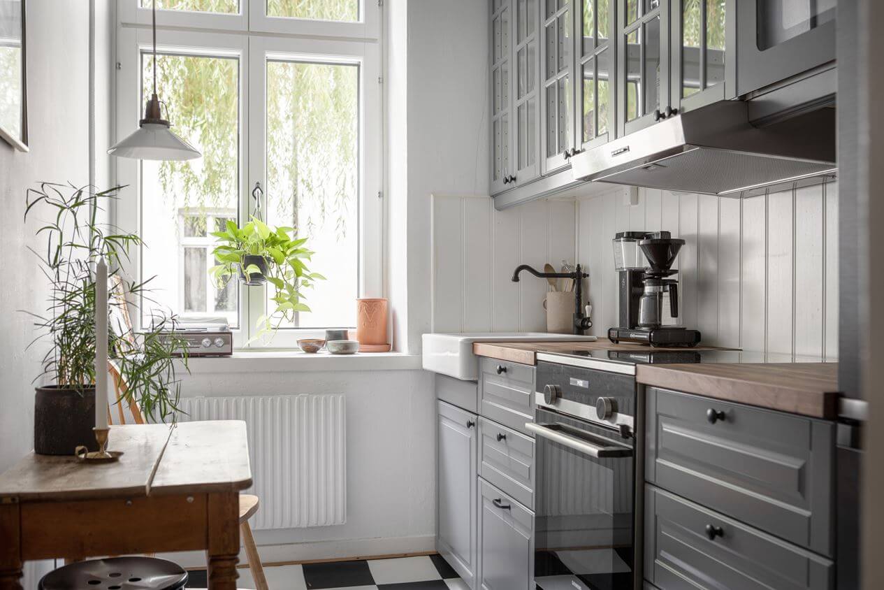 A Studio Apartment with Vintage Decor 8 studio-kitchen-gray-cabinets-nordroom
