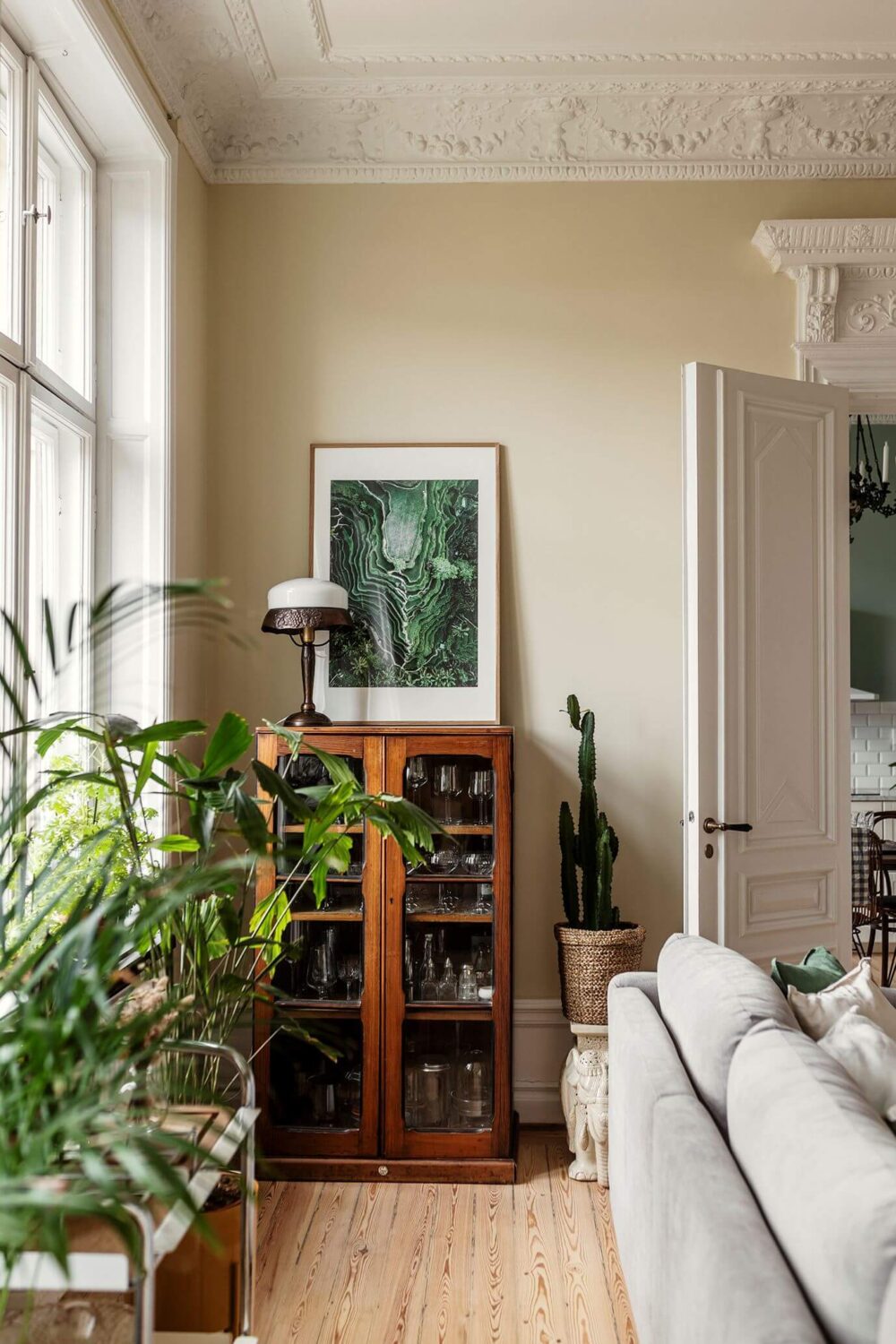 Stunning Fireplaces in a Historic Stockholm Apartment 2 vintage-glass-cabinet-living-room-nordroom