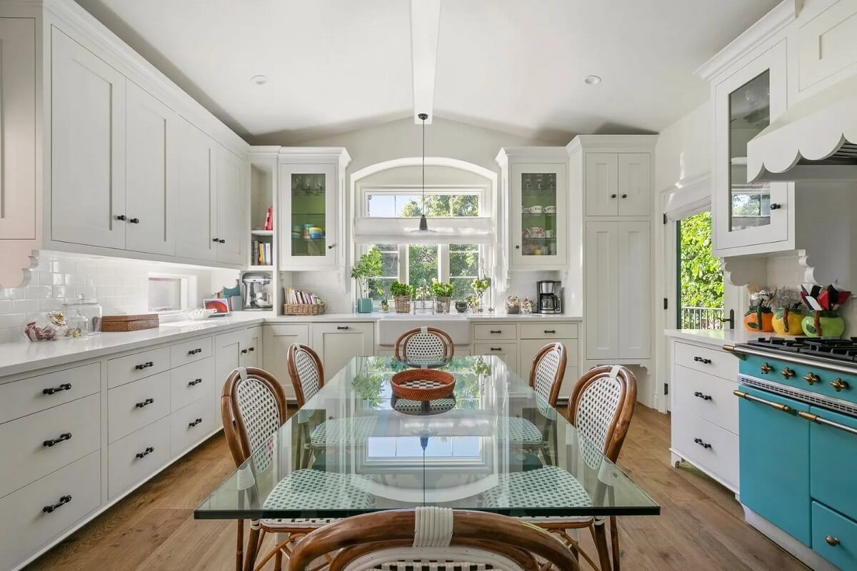 Emma Stone's Colorful Spanish-Style Los Angeles Home is For Sale 5 white-kitchen-glass-dining-table-emma-stone-los-angeles-home-nordroom