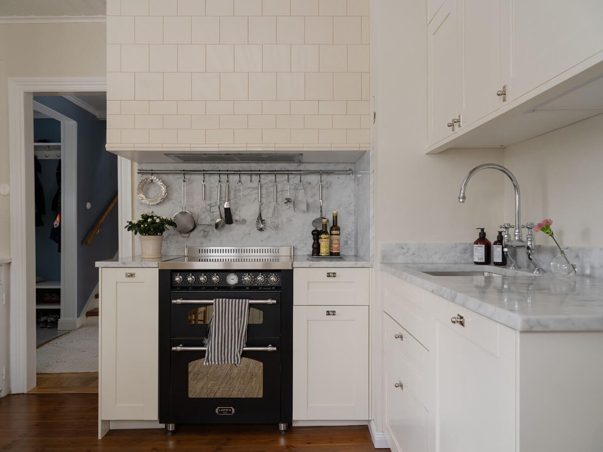 A Light Family Home in a Historic Yellow Villa 14 white kitchen swedish family home nordroom