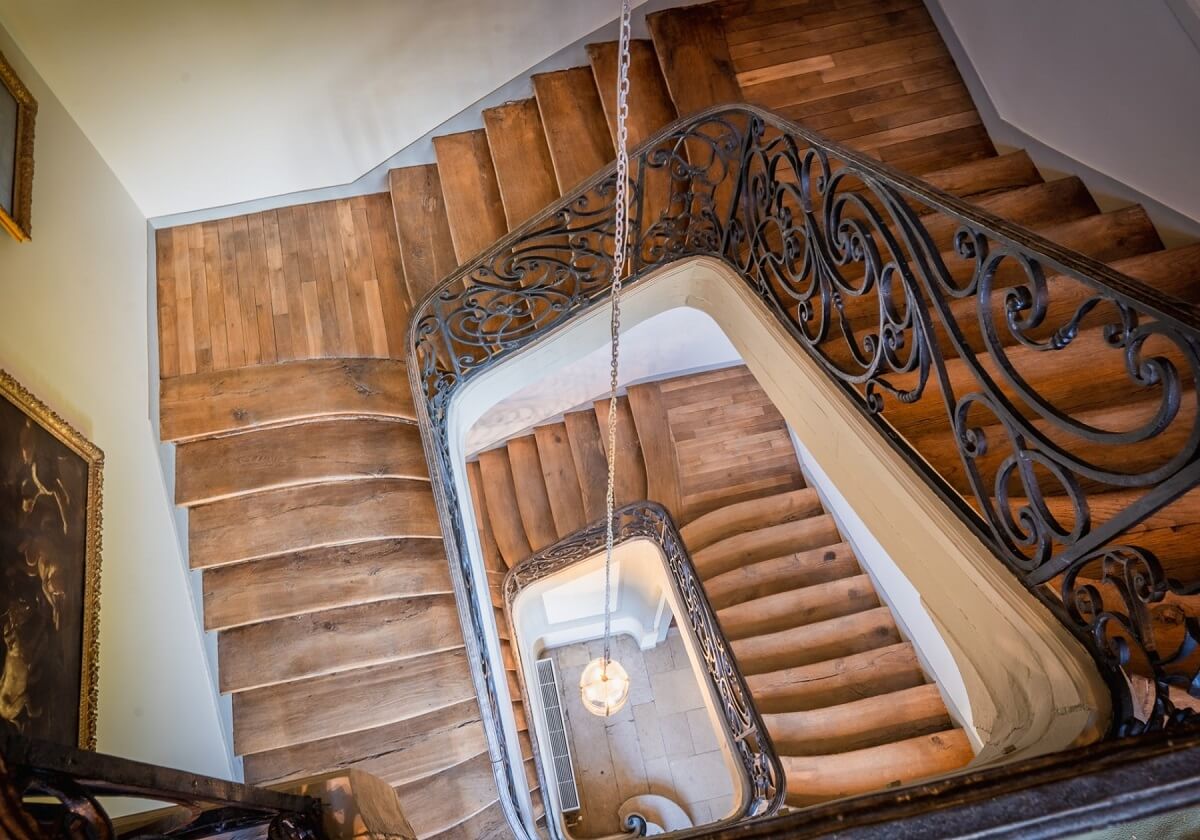 A Renovated 18th Century Chateau in France 11 wooden staircase french chateau