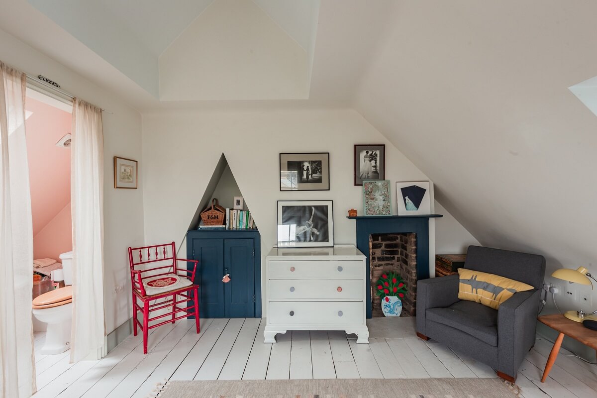 A Home with Cottage Interiors in a Former Cambridge Shop 16 attic bedroom blue accent color