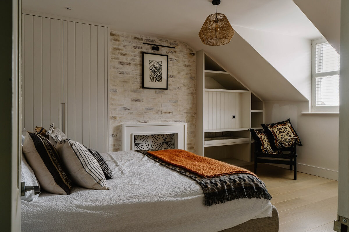 Colorful Walls in an English Victorian Townhouse 21 attic bedroom brick wall fireplace built in wardrobes nordroom