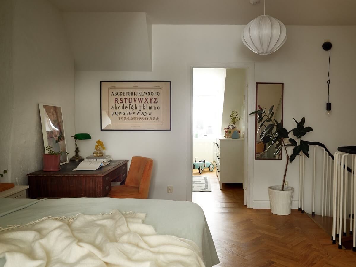 Green Tones in a Renovated Stockholm Duplex Apartment 16 attic bedroom with antique desk