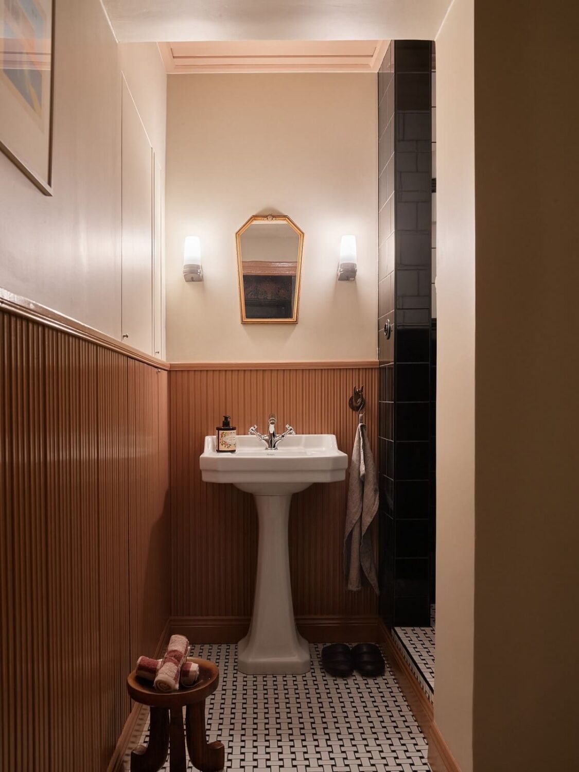Cozy Vintage Style in a Swedish 1920s Apartment 21 bathroom with light brown paneling and mosaic floor nordroom