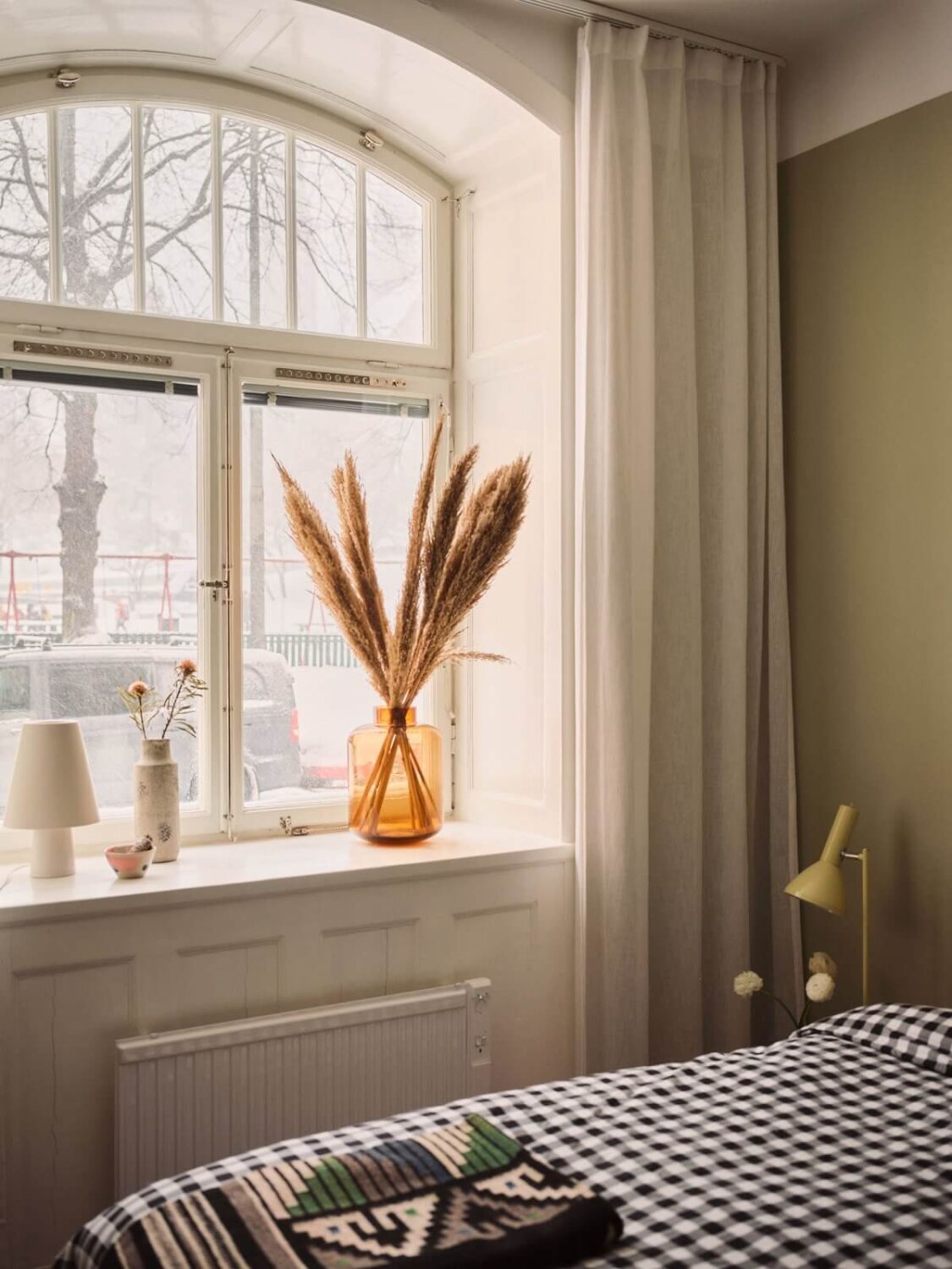 Serene Light Painted Spaces in a Swedish Apartment 15 bedroom-arched-window