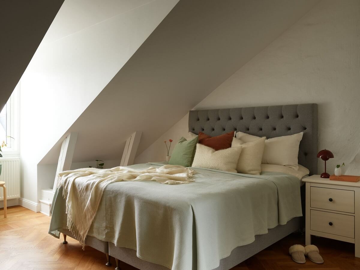 Green Tones in a Renovated Stockholm Duplex Apartment 14 bedroom slanted ceiling
