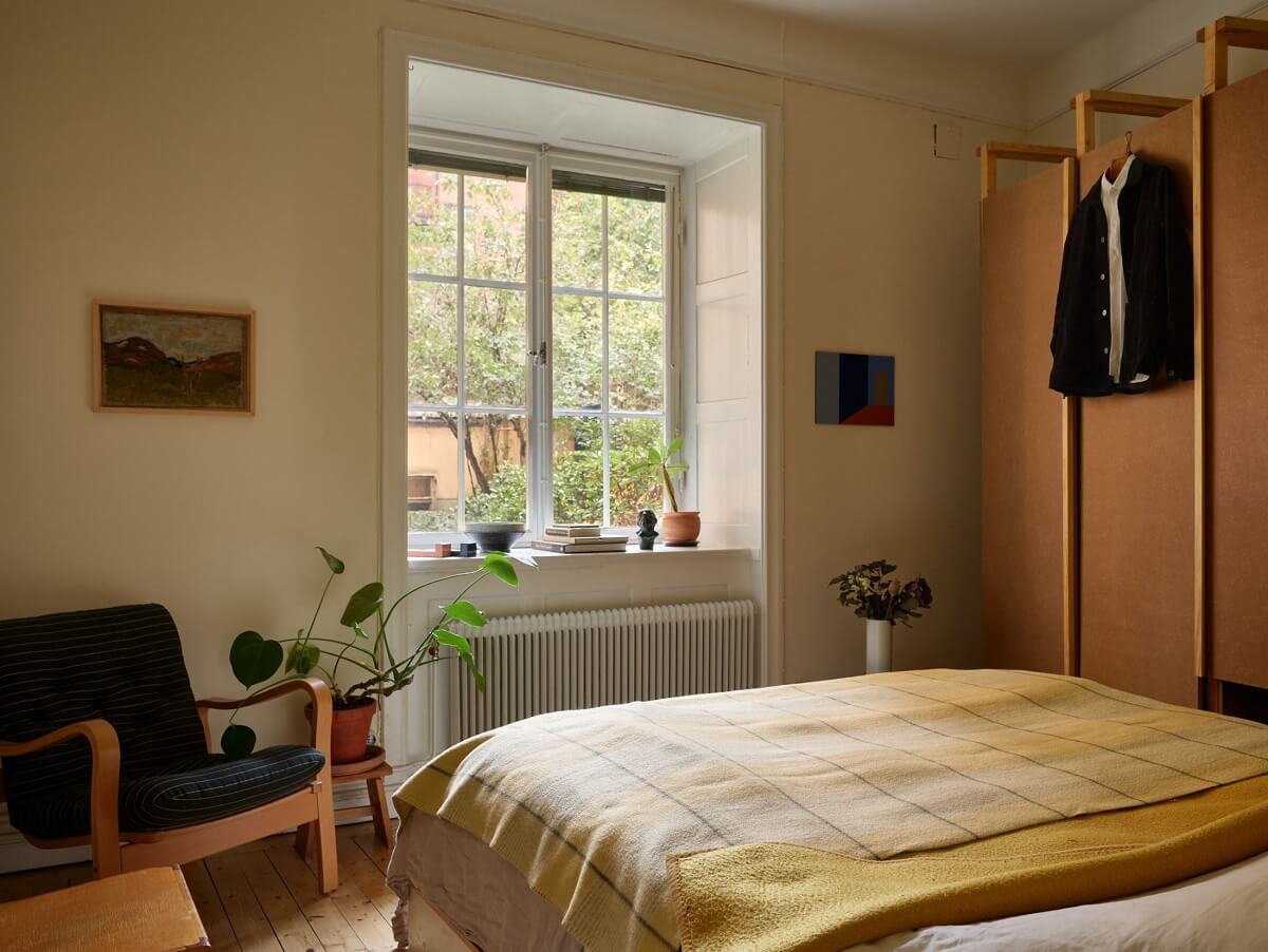 A Cozy Swedish Apartment Filled with Charm 12 bedroom with yellow bedding