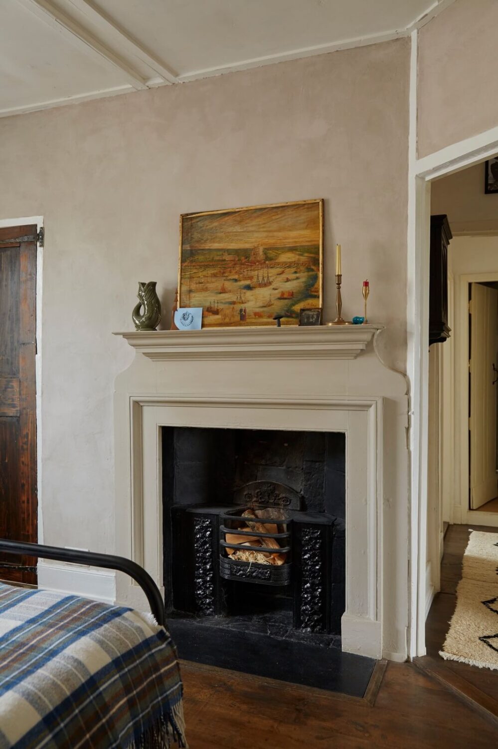 A Cozy Home with Exposed Beams in a Former Post Office 10 bedroom-wooden-floor-fireplace