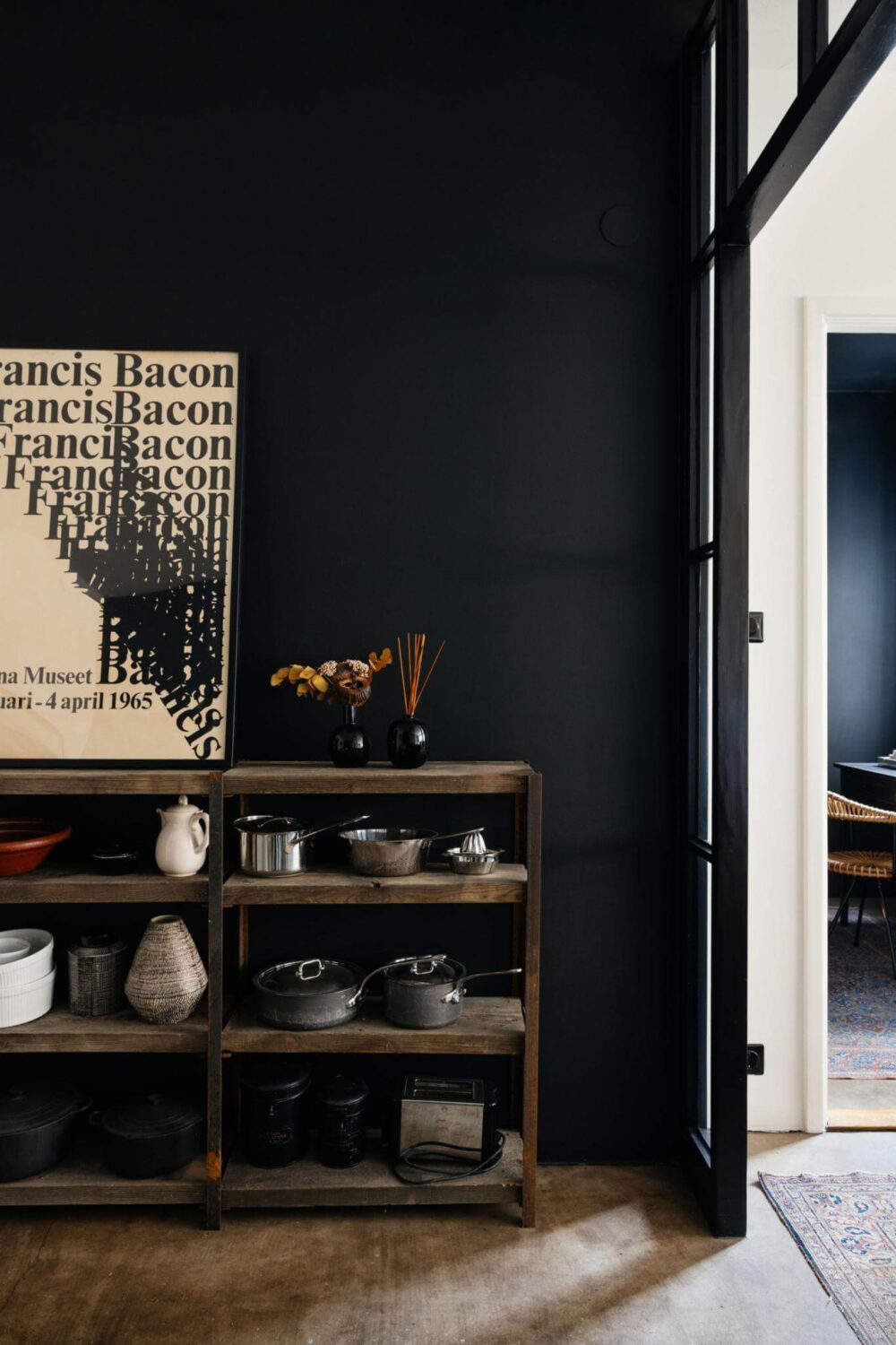 An Industrial Apartment with Black Walls 6 black wall with wooden cabinet kitchen