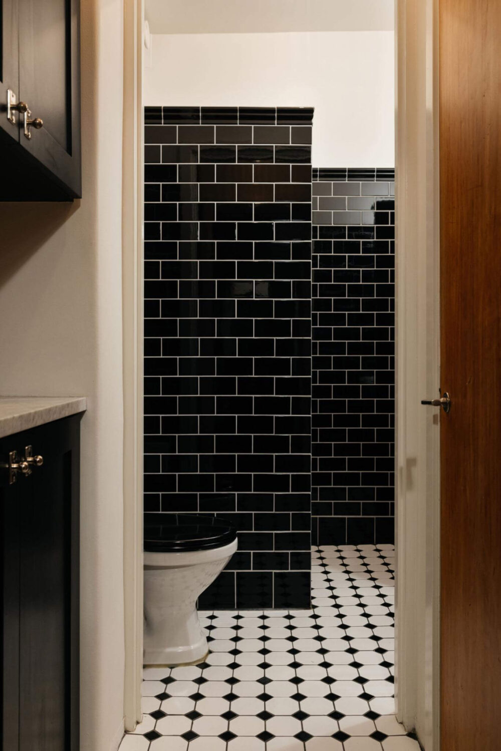 An Industrial Apartment with Black Walls 16 black white bathroom in industrial apartment